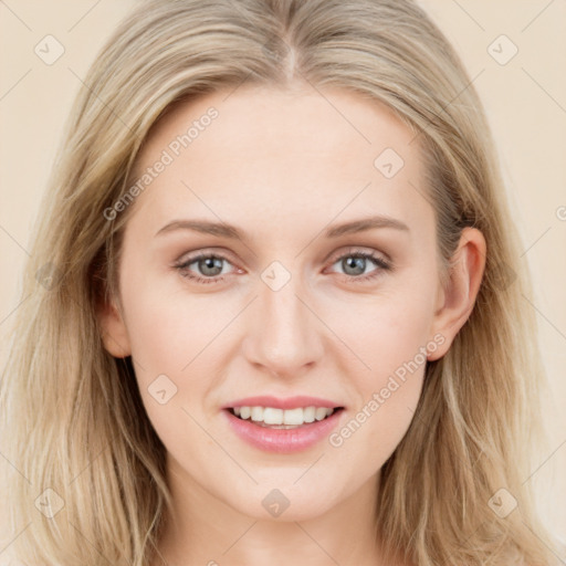 Joyful white young-adult female with long  brown hair and blue eyes