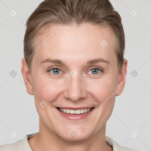 Joyful white adult female with short  brown hair and grey eyes