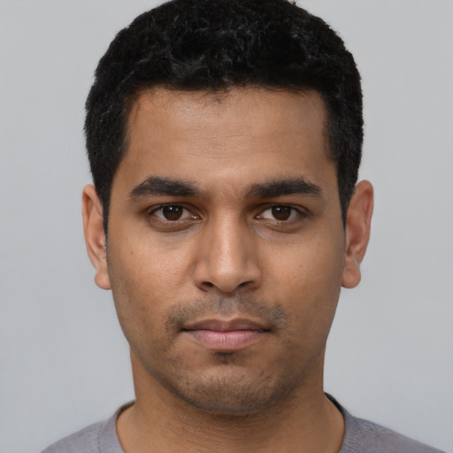 Neutral latino young-adult male with short  black hair and brown eyes