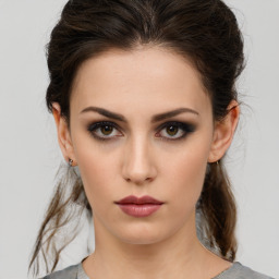 Neutral white young-adult female with medium  brown hair and brown eyes