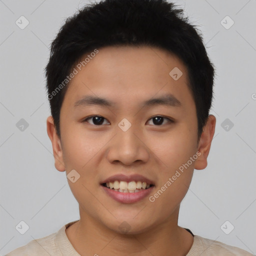 Joyful asian young-adult male with short  black hair and brown eyes