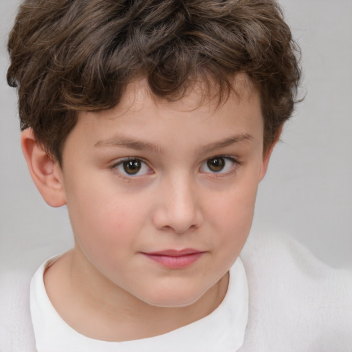 Joyful white child male with short  brown hair and brown eyes