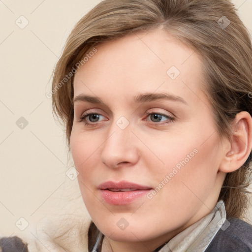 Joyful white young-adult female with medium  brown hair and blue eyes