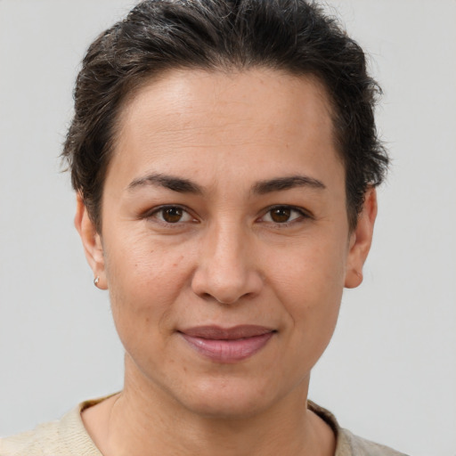 Joyful white adult female with short  brown hair and brown eyes