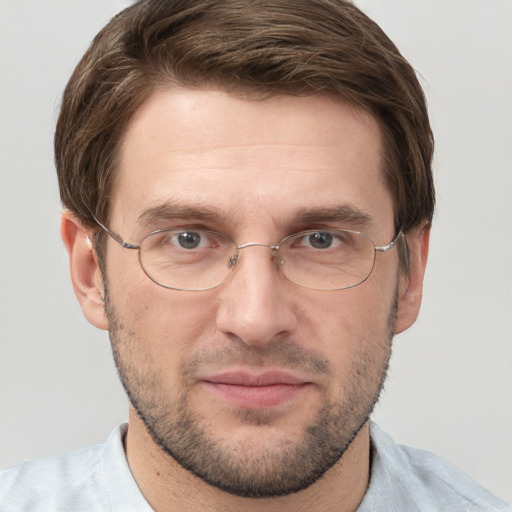 Joyful white adult male with short  brown hair and grey eyes