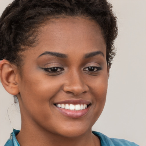 Joyful latino young-adult female with short  brown hair and brown eyes