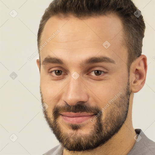 Joyful white young-adult male with short  brown hair and brown eyes