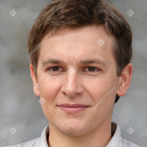 Joyful white adult male with short  brown hair and brown eyes