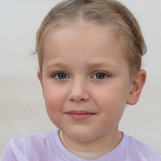 Joyful white child female with short  brown hair and brown eyes