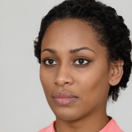 Neutral black young-adult female with short  black hair and brown eyes