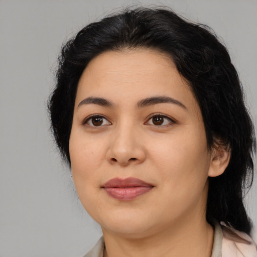 Joyful asian young-adult female with medium  black hair and brown eyes
