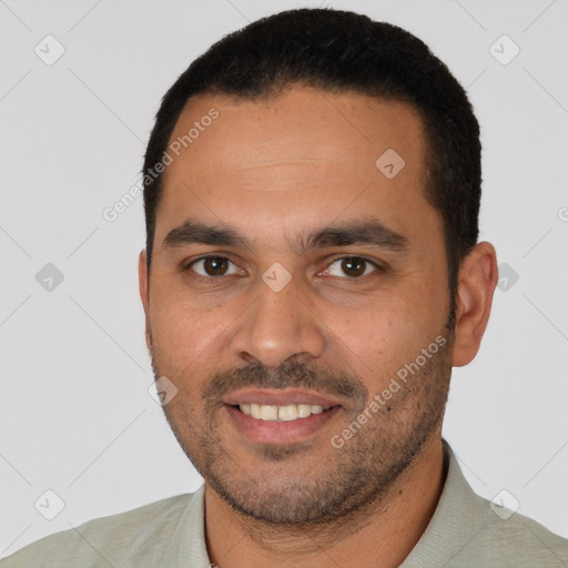 Joyful white young-adult male with short  black hair and brown eyes