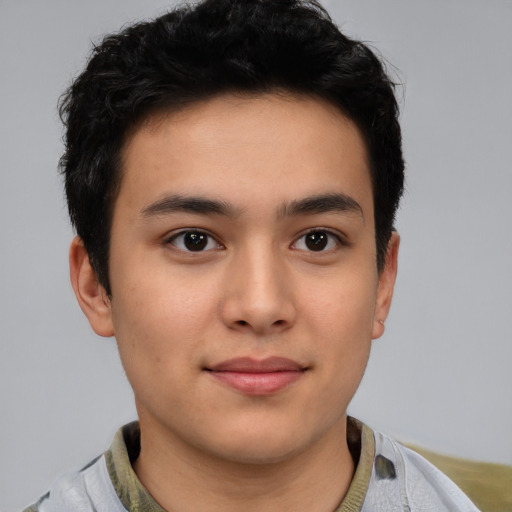 Joyful latino young-adult male with short  brown hair and brown eyes