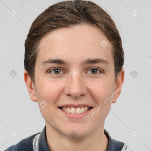 Joyful white young-adult female with short  brown hair and grey eyes