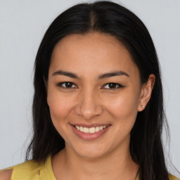 Joyful asian young-adult female with long  brown hair and brown eyes