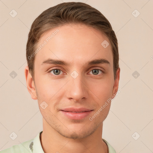 Joyful white young-adult male with short  brown hair and grey eyes