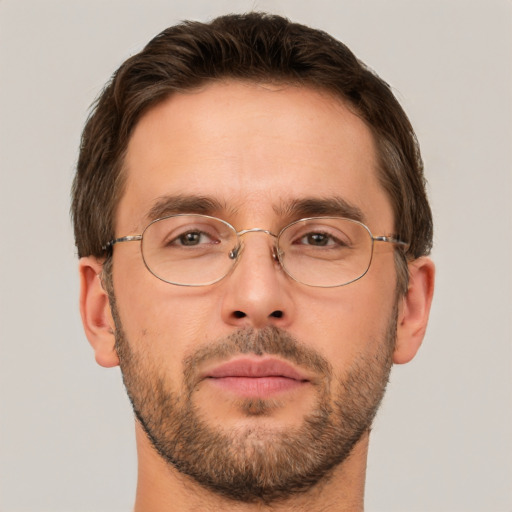 Joyful white adult male with short  brown hair and brown eyes