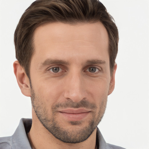 Joyful white adult male with short  brown hair and brown eyes