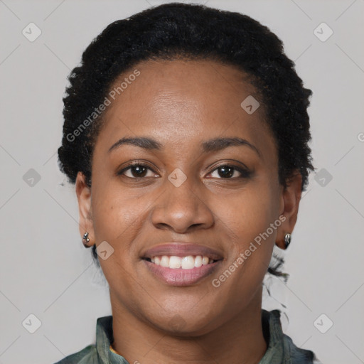 Joyful black young-adult female with short  black hair and brown eyes