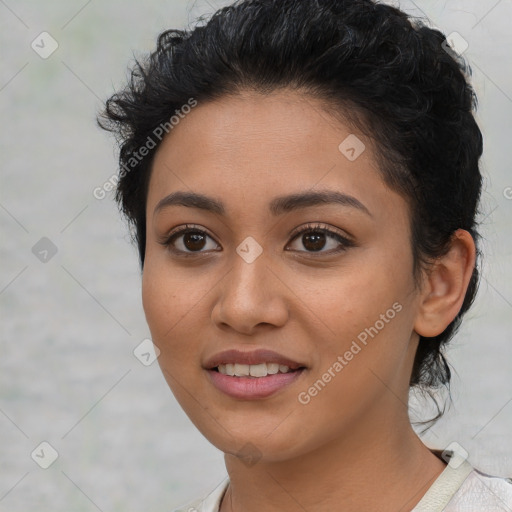 Joyful latino young-adult female with short  black hair and brown eyes