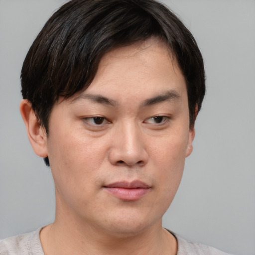 Neutral asian young-adult male with short  brown hair and brown eyes
