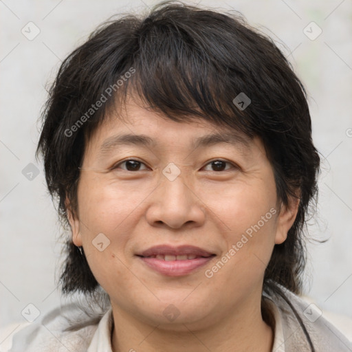 Joyful white adult female with medium  brown hair and brown eyes