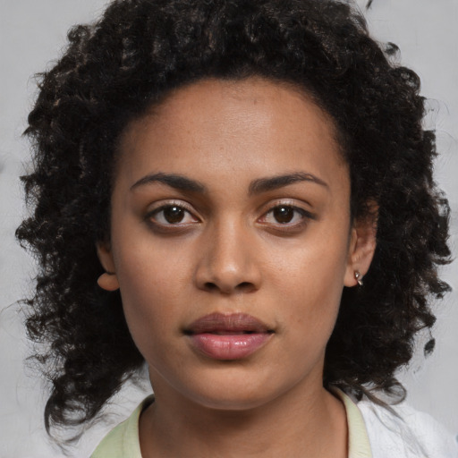 Neutral black young-adult female with medium  black hair and brown eyes