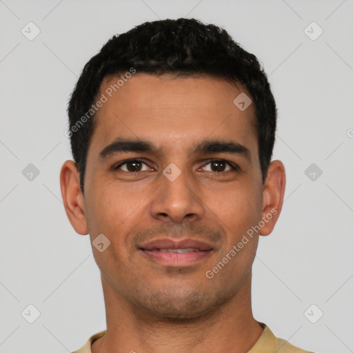 Joyful latino young-adult male with short  black hair and brown eyes