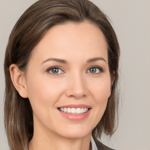 Joyful white young-adult female with medium  brown hair and brown eyes