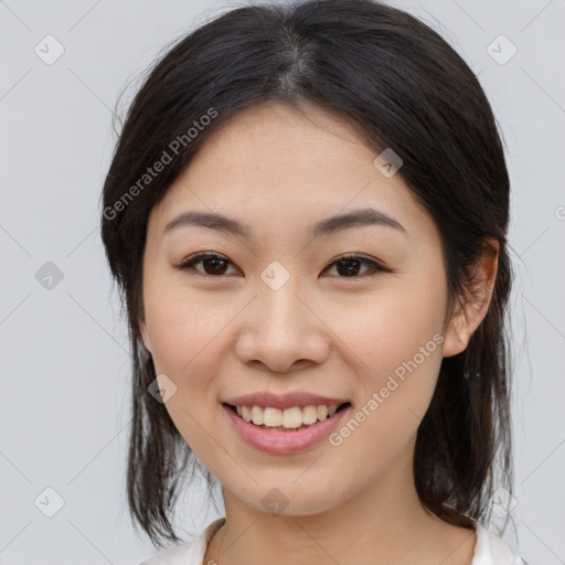 Joyful white young-adult female with medium  brown hair and brown eyes