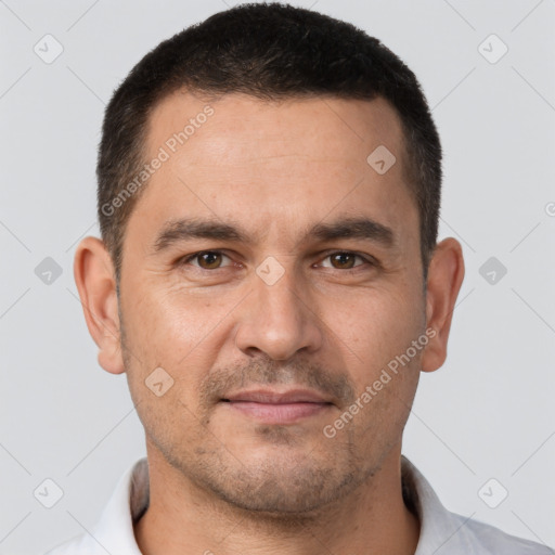 Joyful white adult male with short  brown hair and brown eyes