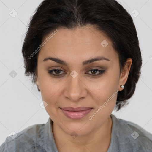 Joyful latino young-adult female with medium  brown hair and brown eyes