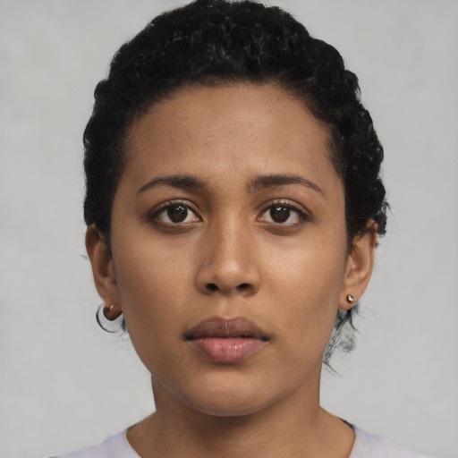 Neutral latino young-adult female with short  black hair and brown eyes