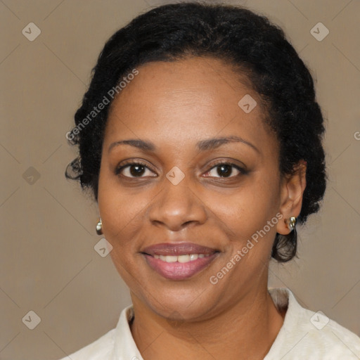 Joyful black adult female with medium  black hair and brown eyes