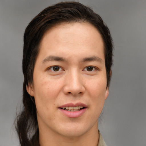 Joyful white adult male with medium  brown hair and brown eyes