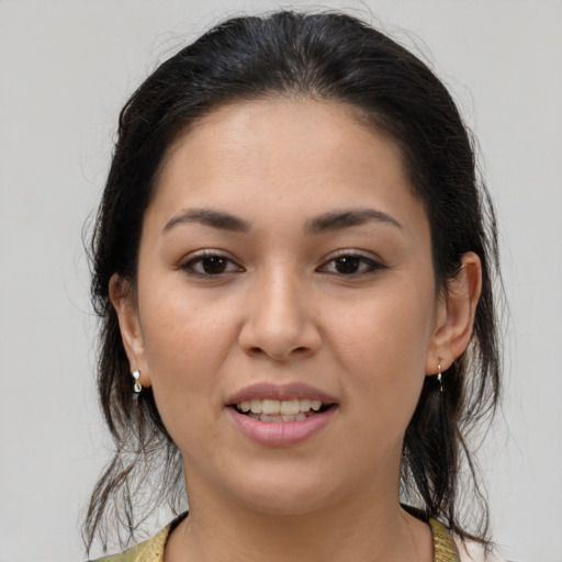 Joyful latino young-adult female with medium  brown hair and brown eyes