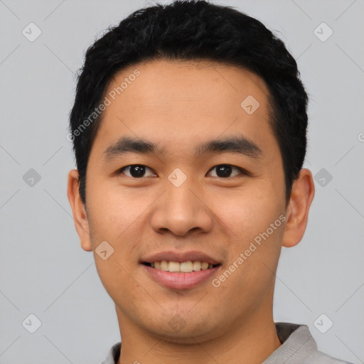 Joyful asian young-adult male with short  black hair and brown eyes