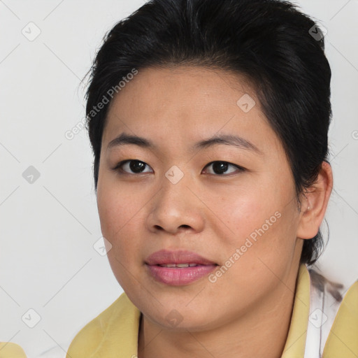 Joyful asian young-adult female with medium  brown hair and brown eyes