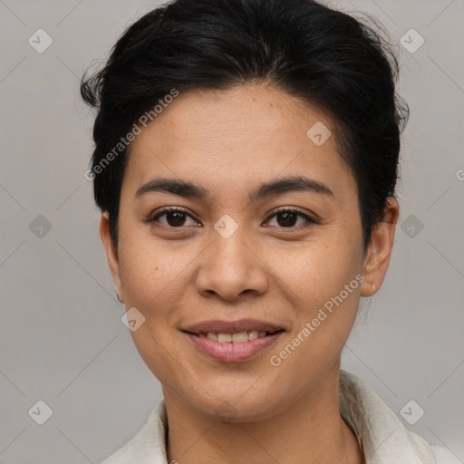 Joyful latino young-adult female with short  brown hair and brown eyes