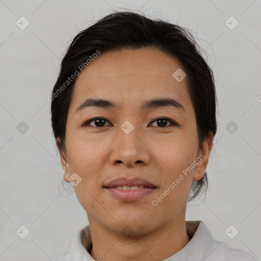 Joyful asian young-adult female with short  brown hair and brown eyes