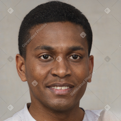 Joyful black young-adult male with short  brown hair and brown eyes