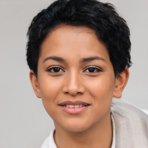 Joyful latino young-adult female with short  black hair and brown eyes