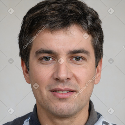 Joyful white young-adult male with short  brown hair and brown eyes