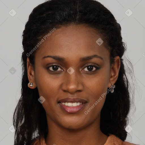 Joyful black young-adult female with long  brown hair and brown eyes