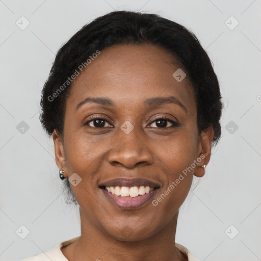 Joyful black adult female with short  brown hair and brown eyes