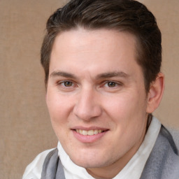 Joyful white adult male with short  brown hair and brown eyes