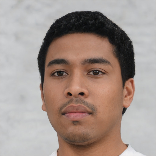 Neutral latino young-adult male with short  black hair and brown eyes
