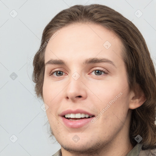 Joyful white young-adult male with medium  brown hair and brown eyes