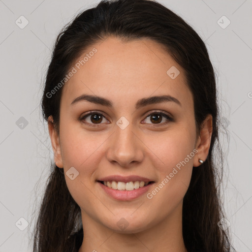 Joyful white young-adult female with long  brown hair and brown eyes