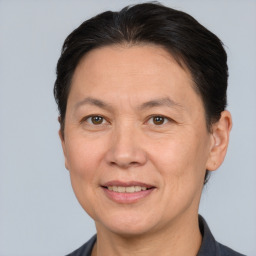 Joyful white adult female with short  brown hair and brown eyes